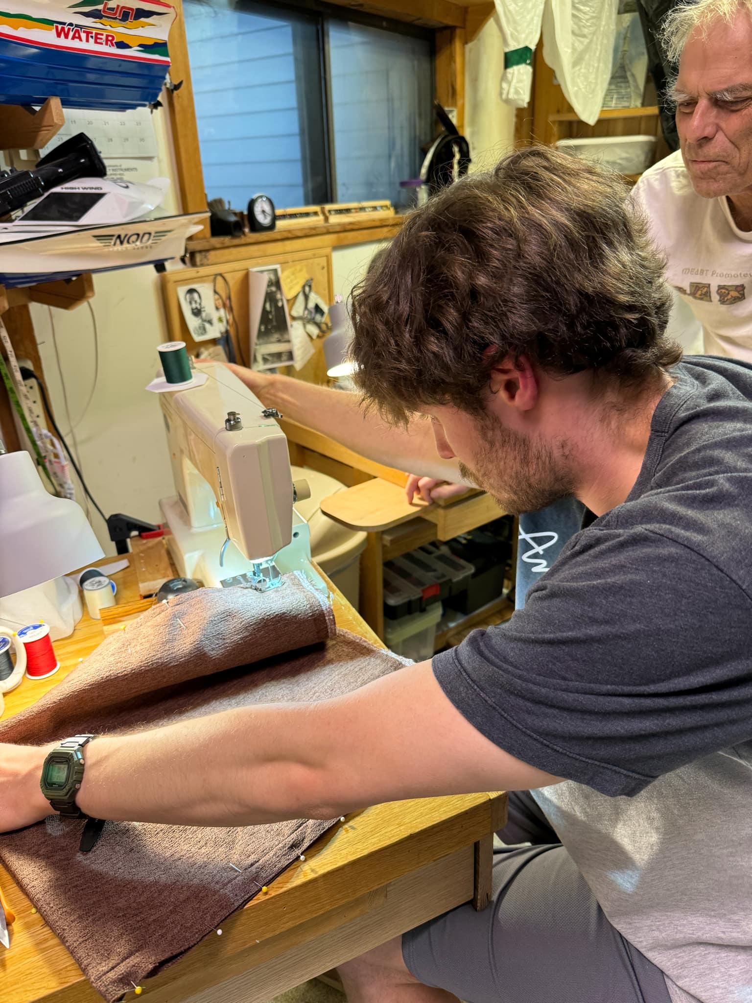 Me with my grandpa sewing in his shop